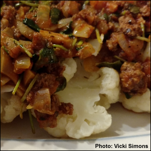 Spaghetti sauce with meat and microgreens over steamed cauliflower. Photo by Vicki Simons.